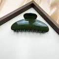 Glossy dark green semi-circular shark hair claw clip for elegant French style updos - Green
