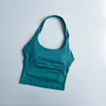 Detail of teal seamless high-stretch sports bra with vertical ribbed side texture - S / Teal