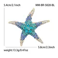 Dimensions de la broche étoile de mer: hauteur 5,4 cm et largeur 5,8 cm avec strass - Or Bleu