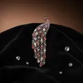 Elegant peacock brooch with colorful crystals and long dangling tassels on black velvet - Gray Multi-color