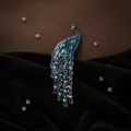 Elegant silver peacock brooch with sparkling blue marquise rhinestones and long tail - Peacock Blue