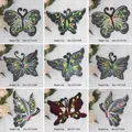Detailansicht von neun Schmetterlings-Stickereien mit Gewichts- und Größenangaben - Traumhaftes Schmetterlings-Komplettset