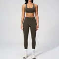 Women's two-piece yoga set in dark olive green with white seam contrast stitching - S / Top And Bottom / Sports Bra + Leggings / Deep Brown