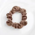 Deep bronze satin scrunchie with silky finish on a white ceramic display tray - Scrunchie / Satin Brown