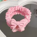 Pink fabric scrunchie with cute bow detail displayed on a heart-shaped mirror surface - Bow Scrunchie / Pink
