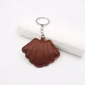 Detail of deep brown shell leather keychain with lychee texture and silver metal ring - Lychee Pattern Coffee