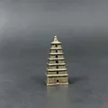 Close-up of a 7-tier miniature metal pagoda with vintage bronze finish and solid base - Giant Wild Goose Pagoda