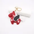 Detailed side view of handmade red leather unicorn charm with black wings and gold clasp - Wine Red Unicorn Pegasus