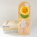 Handmade crochet sunflower with smiling face for Mother's Day gift on pink card - Smiley Sunflower