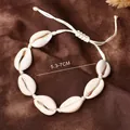 Handmade woven cowrie shell anklet with adjustable cream cord and natural sea shells - White Woven Rope Style