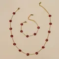 Detail of bohemian stainless steel jewelry set with red beaded flowers and metal tags - Wine Red Necklace And Bracelet
