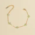 Gold chain bracelet featuring light green beaded flowers with adjustable clasp - Grape Green Bracelet