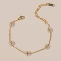 Bohemian gold stainless steel bracelet with five transparent flower charms and lobster clasp - Transparent White Bracelet