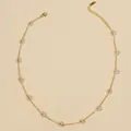 Gold stainless steel chain necklace featuring transparent flower beads and lobster clasp - Transparent White Necklace