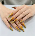 Detail of long coffin press-on nails with metallic laser gradient in orange and green - 24Pcs/Box (Includes Jelly Glue + Nail File) / Holographic Gradient Color (AW523)