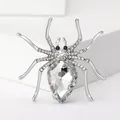 Close-up of spider brooch with large pear-cut crystal and micro-pave rhinestones - Silver and White Spider Style