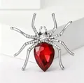 Sparkling spider brooch featuring a large red pear-cut stone and silver crystal legs - Silver and Red Spider Style