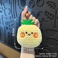 Cute pineapple plush keychain with embroidered smiley face and green felt leaves - Pineapple