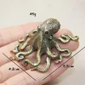 Detailed view of octopus figurine in vintage bronze with weight and size markings - Large Octopus