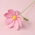 Pink handmade crochet daisy with yellow pistil and green leaf on pink background - Xue Wu Galsang Flower - Pink