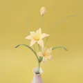 Handmade crochet lily flowers in light yellow yarn presented in a ceramic vase - Zephyrlanthes-Yellow