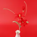 Handmade crochet red lily flowers in white vase against a matching red background - Zephyrlanthes-Red