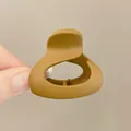 Mustard yellow matte hair claw clip for ponytail styling with ergonomic triangular design - Semicircle Style / Caramel color