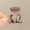 Mini matte taupe triangle hair claw clip for high ponytail shown in hand for size - Mini Claw Clip / Matte Milk Tea