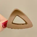 Matte brown triangle hair claw clip for high ponytail in minimalist sleek design - Hollow Triangle / Matte Coffee Brown