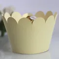 Elegant cream-colored scalloped cupcake wrapper with matte finish for parties - Platinum