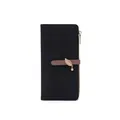 Detail view of long black wallet with brown strap, gold leaf charm and zipper closure - Metal Leaf Pendant Style / Black