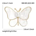 Elegante broche de mariposa dorada con nácar blanco y perla central, ancho 3,9 cm - Blanco Dorado