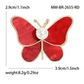 Broche de mariposa roja con textura de mármol, perla y borde de metal dorado - Rojo Dorado