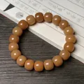 Polished brown bodhi root bead bracelet with cat paw carving on vintage book background - Charred Old Type (Single Loop)