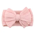 Pink jacquard knit baby headband featuring a large elastic textured bow decoration - Light Pink