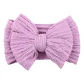 Elastic lilac knit baby headband with a large bow featuring a classic cable texture - Light Purple