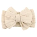 Creamy white knitted baby headband with a large jacquard bow and cable knit pattern - Off White