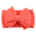 Elastic coral red baby headband with a large textured jacquard knit bow decoration - Watermelon Red