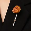 Artistic dried rose brooch in silver metal holder pinned on a black suit lapel - White Gold Finish Tube Brooch (A-1129) / Silver