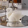 White swan scented candle in 78g size with detailed feather texture and mirror reflection - White Swan