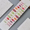 Press-on nails featuring 3D fruit patterns and embossed textures on a white rack - WY-133 / 10 Pieces In Xs Size