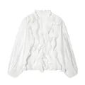 Macro view of white ruffled V-neck chiffon blouse with elegant satin texture and S size label - White