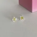 Silver stud earrings featuring heart-shaped yellow zircon stones in a prong setting - Yellow