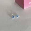 Silver stud earrings featuring two sparkling blue heart-shaped zircons with pin closure - Blue