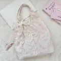 Close-up of pink checkered tote bag with white lace bow and cute cat print detail - Pink Cat Print With White Flower