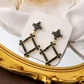 Elegant gold vintage pearl earrings featuring black square zircons and star motif - Square Geometric Black Zirconia Drop Earrings (E5904)