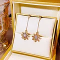 Golden tassel earrings with champagne crystal sunflower charm in a jewelry gift box - Champagne Sunflower Tassel Style (E2092-2) / Champagne
