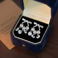 Silver bow tassel earrings with sparkling rhinestones and crystal pendants on blue velvet - Rhinestone Bow Tassel Style (E2640-3) / Silver