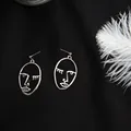 Silver-plated minimalist abstract face line art earrings on a textured black backdrop - Line Drawing Art Abstract Face Style (E1097-2) / Silver