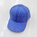 Close-up of sparkling blue rhinestones on a stylish baseball cap with curved brim - Adult Size (Adjustable) / Sapphire Blue